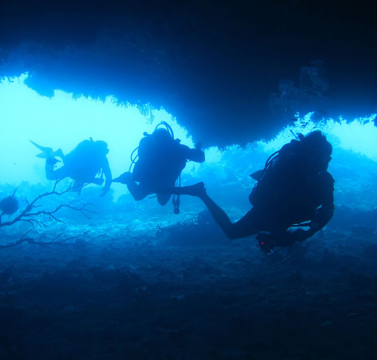 Divers in Coral Sea Caves