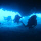 Divers in Coral Sea Caves